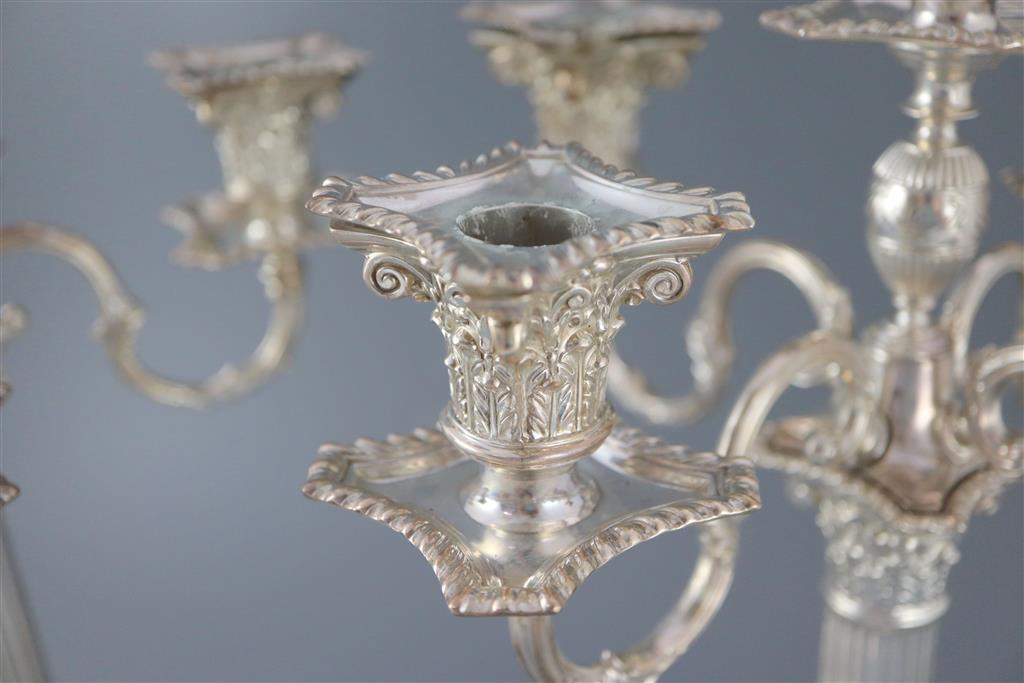 A pair of late Victorian silver corinthian column four branch, five light candelabra by Carrington & Co,